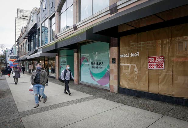 (210205) -- VANCOUVER, Feb. 5, 2021 -- People wearing face masks walk past space for lease in downtown Vancouver, British Columbia, Canada, on Feb. 5, 2021. The unemployment rate in Canada rose by 0.6 percentage point to 9.4 percent in January, the highest rate since August 2020, said official Statistics Canada on Friday. (Photo by Xinhua) CANADA-VANCOUVER-UNEMPLOYMENT RATE-RISING LiangxSen 
