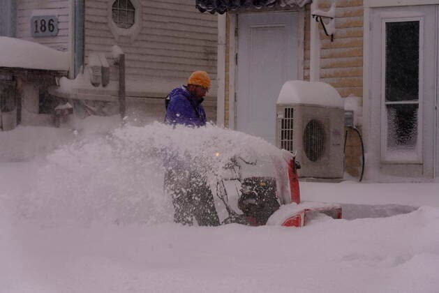 February 8, 2021, Charlottetown, PE, Canada: A man uses a snowblower during a snowstorm in Charlottetown on Monday, Feb. 8, 2021. Charlottetown Canada  - ZUMAc35_ 20210208_zaf_c35_003 Copyright: xJohnxMorrisx
