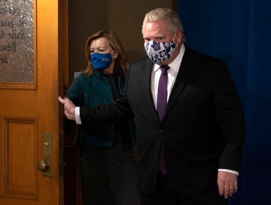 February 8, 2021, Toronto, on, Canada: Ontario Premier Doug Ford opens the door as he and Health Minister Christine Elliott arrive for the daily briefing in Toronto on Monday, February 8, 2021. Toronto Canada  - ZUMAc35_ 20210208_zaf_c35_019 Copyright: xFrankxGunnx
