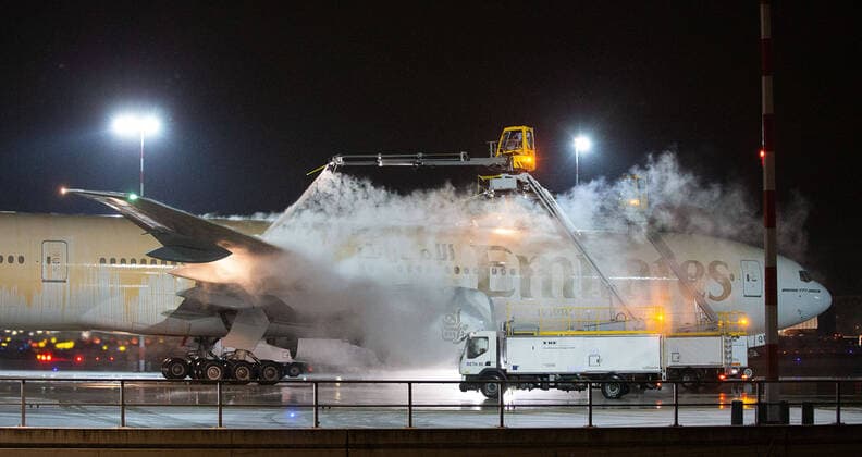 Germany Hesse Frankfurt 08 02 2021 Winter onset in Hesse 2021 De-icing the A6 EQM Boeing 777 31H ER Emirates is important to prevent controls from freezing Aircraft de-icing is the process of removing ice and snow from an aircraft De-icing is required for safety reasons, as