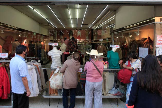 February 9, 2021, Mexico City, Mexico City, Mexico: Person queue to be allowed to enter a store, after closed several days due red alert by Covid. The Mexican Government allowed the reopening of stores, some shops make outside sell to prevent crowd of people, as an attempt to prevent spread of the Virus February 9, 2021 in Mexico City, Mexico Mexico City Mexico - ZUMAe321 20210209_zia_e321_035 Copyright: xAngelxMoralesxRizox