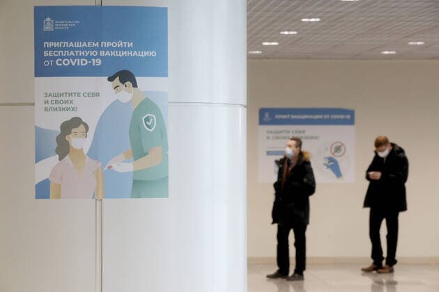 MOSCOW REGION, RUSSIA - FEBRUARY 10, 2021: People outside a COVID-19 mobile vaccination center at Domodedovo International Airport. Alexander Shcherbak TASS  TS0F66B7
