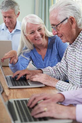 Tutor Helping Senior Man In Computer Class ,model released, Symbolfoto ,property released Copyright: xHighwaystarz LOOPxIMAGESx HSZ09819RF16050