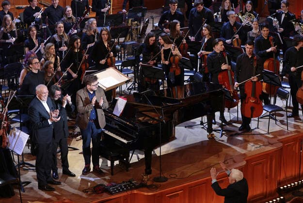 MOSCOW, RUSSIA - FEBRUARY 12, 2021: Actor Sergei Garmash, conductors Yuri Bashmet and Kuzma Bodrov (L-R front) take part in a gala concert held at the Moscow State Tchaikovsky Conservatory to close the Winter International Arts Festival. Gavriil Grigorov TASS  TS0F6AA0