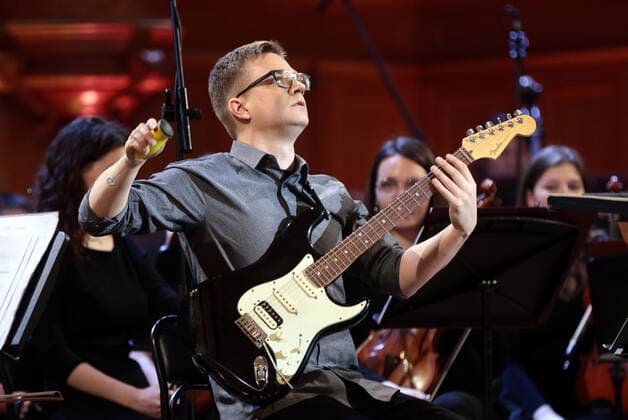 MOSCOW, RUSSIA - FEBRUARY 12, 2021: German guitarist Nico Couck performs in a gala concert held at the Moscow State Tchaikovsky Conservatory to close the Winter International Arts Festival. Gavriil Grigorov TASS  TS0F6AA3