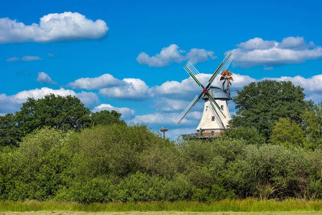 Galleriehollaender windmill in Barssel at the Soeste, stork nest in the background, Germany, Lower Saxony, Oldenburger Muensterland, Barssel smock mill in Barssel at the Soeste, stork nest in the background, Germany, Lower Saxony, Oldenburger Muensterland, Barssel BLWS638219 Copyright: xblickwinkel McPHOTO W.xRolfesx