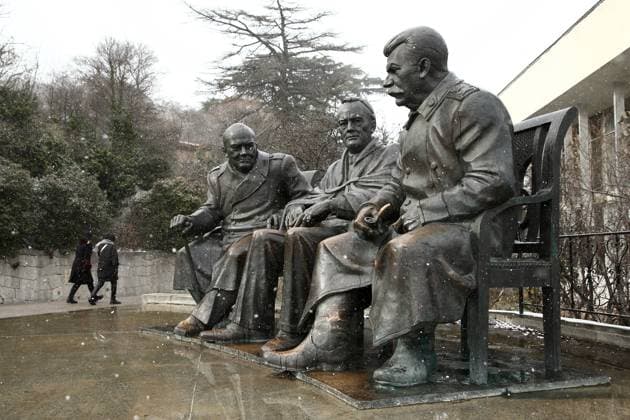 CRIMEA, RUSSIA - FEBRUARY 13, 2021: A view of the monument to the 1945 Yalta Conference participants, UK Prime Minister Winston Churchill, US President Theodore Roosevelt and Soviet Union leader Joseph Stalin (L-R) on display at the Livadia Palace and Park Museum Reserve during a snowfall in the Black Sea resort city of Yalta, southern Crimea. Sergei Malgavko TASS  TS0F6B64