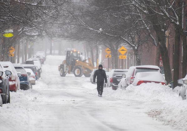 February 16, 2021, Montreal, PQ, Canada: A man walks along a street during a snowstorm in Montreal, Tuesday, February 16, 2021. Montreal Canada  - ZUMAc35_ 20210216_zaf_c35_021 Copyright: xGrahamxHughesx