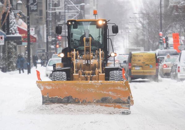 February 16, 2021, Montreal, PQ, Canada: A plow clears a street following a snowstorm in Montreal, Tuesday, February 16, 2021. Montreal Canada  - ZUMAc35_ 20210216_zaf_c35_025 Copyright: xGrahamxHughesx