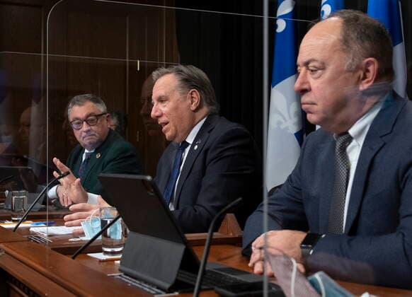 February 16, 2021, QUEBEC, PQ, Canada: Quebec Premier Francois Legault, centre, speaks during a news conference on the COVID-19 pandemic, Tuesday, February 16, 2021 at the legislature in Quebec City. Horacio Arruda, Quebec director of National Public Health, left, Quebec Health Minister Christian Dube, right, look on. QUEBEC Canada - ZUMAc35_ 20210216_zaf_c35_076 Copyright: xJacquesxBoissinotx