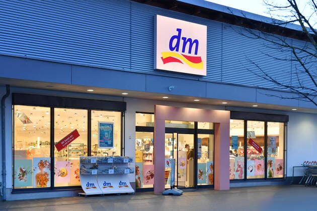 Hardly any customer traffic in a dm drugstore because of corona,pandemic,spread,corona crisis,coronavirus,virus,pathogen branch,store,shop,entrance,entrance area,trade,business,