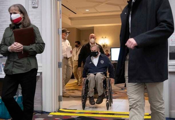 February 17, 2021, Austin, Texas, USA: Texas Gov. GREG ABBOTT enters for a press conference and talk with emergency officials in the State Operations Center while Texas deals with record snow and bitter cold in all 254 counties. About a quarter of the state is still without power as officials deploy state resources on a multitude of fronts. Austin USA - ZUMAd150 20210217_znp_d150_026 Copyright: xBobxDaemmrichx