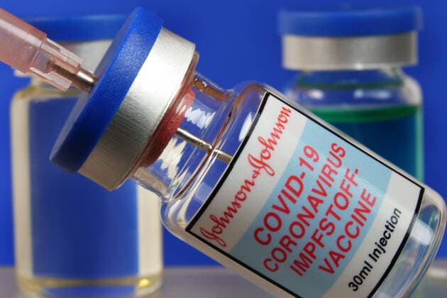 Symbol image syringe with vaccine against Covid 19 Corona vaccination