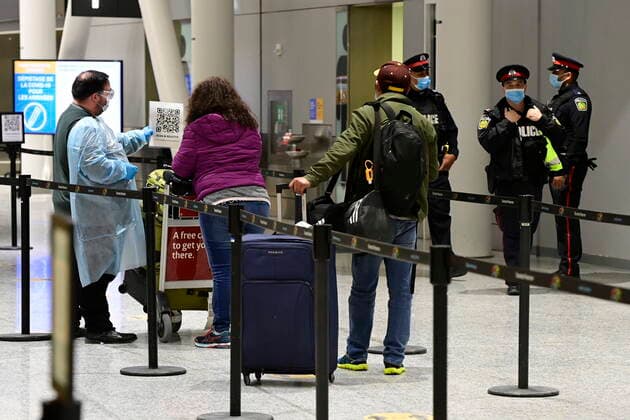 February 22, 2021, Toronto, on, Canada: Travellers, who are not affected by new quarantine rules, arrive at Terminal 3 at Pearson Airport in Toronto early Monday, February 22, 2021. Prime Minister Justin Trudeau announced that all travellers entering Canada by air would have to quarantine in a hotel for three days at their own expense starting later today. Toronto Canada  - ZUMAc35_ 20210222_zaf_c35_006 Copyright: xFrankxGunnx