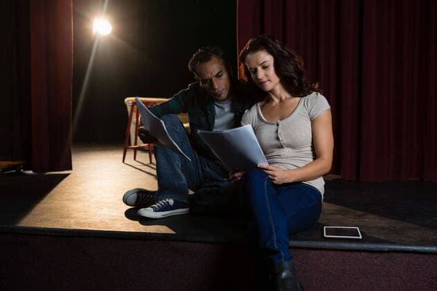 Actors reading their scripts on stage Actors reading their scripts on stage in theatre, model released, , property released, Cape Town, South Africa, 20.04.2017, 1061207.jpg, theatre, movie theatre, cinema, film industry, leisure, entertainment, casual clothing, role-play, pretending, curtain, red, acting, actor, actress, paper, sheets, lines, reading, rehearsal, sitting, rehearsing, read, stage, arts, drama, dramatic, modern, beautiful, pretty, attractive, audition, casting, play, nervous, lifestyle 40s, Mature Adult, Man, Male, Mixed-Race, 30s, Mid Adult, Caucasian, 40-44 Years, Mature Men, Mixed-Race Person, 30-34 Years, Mid Adult Men, Caucasian Ethnicity Indoors,Full length