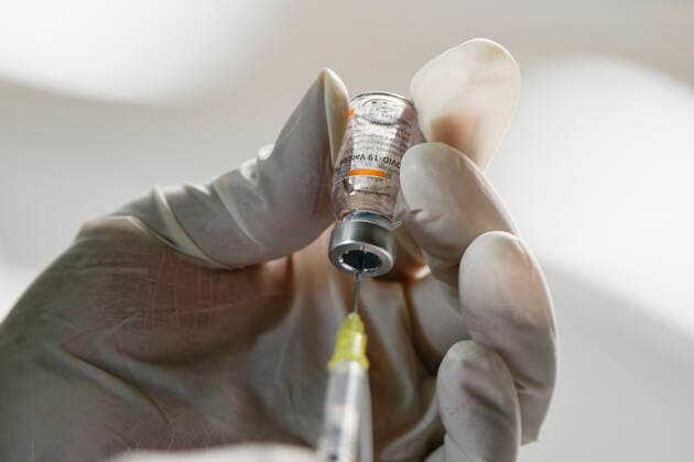 (210223) -- ECATEPEC, Feb. 23, 2021 -- A medical worker prepares a dose of COVID-19 vaccine developed by Chinese pharmaceutical company Sinovac at a vaccination site in Ecatepec, Mexico, Feb. 22, 2021. Mexican health authorities on Monday began to vaccinate older adults with a COVID-19 vaccine developed by Chinese pharmaceutical company Sinovac, after a shipment of doses arrived on Saturday. Mexico s government designated the first shipment of the Sinovac vaccine to arrive in Ecatepec, a city in central State of Mexico that lies on the outskirts of the capital Mexico City. Early in the day, brigades of healthcare workers began to administer the vaccine to hundreds of residents aged 60 and over who went to the Las Americas cultural 