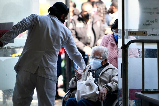 (210223) -- ECATEPEC, Feb. 23, 2021 -- Citizens wait in line to receive the COVID-19 vaccines developed by Chinese pharmaceutical company Sinovac at a vaccination site in Ecatepec, Mexico, Feb. 22, 2021. Mexican health authorities on Monday began to vaccinate older adults with a COVID-19 vaccine developed by Chinese pharmaceutical company Sinovac, after a shipment of doses arrived on Saturday. Mexico s government designated the first shipment of the Sinovac vaccine to arrive in Ecatepec, a city in central State of Mexico that lies on the outskirts of the capital Mexico City. Early in the day, brigades of healthcare workers began to administer the vaccine to hundreds of residents aged 60 and over who went to the Las Americas cultura 