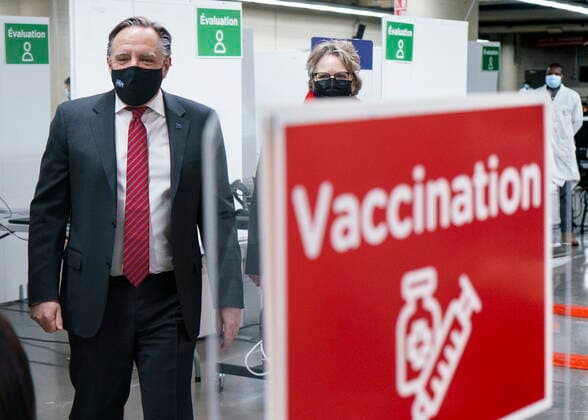 February 23, 2021, Montreal, PQ, Canada: Quebec Premier Francois Legault tours a COVID-19 vaccination clinic in Montreal s Olympic Stadium on Tuesday, February 23, 2021. Montreal Canada  - ZUMAc35_ 20210223_zaf_c35_042 Copyright: xPaulxChiassonx
