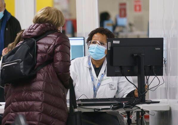 February 23, 2021, Montreal, PQ, Canada: A patient is registered at a COVID-19 vaccination clinic in Montreal s Olympic Stadium on Tuesday, February 23, 2021. Montreal Canada  - ZUMAc35_ 20210223_zaf_c35_056 Copyright: xPaulxChiassonx