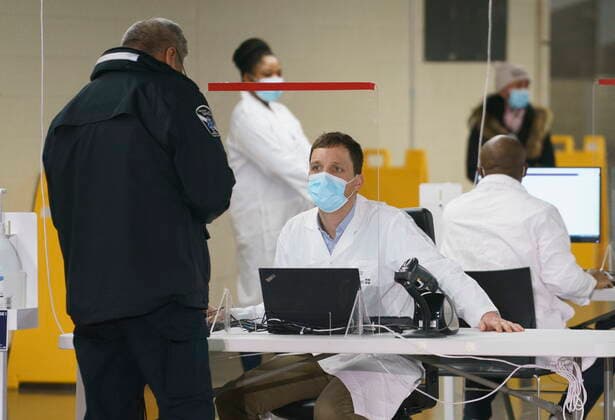 February 23, 2021, Montreal, PQ, Canada: A patient is registered at a COVID-19 vaccination clinic in Montreal s Olympic Stadium on Tuesday, February 23, 2021. Montreal Canada  - ZUMAc35_ 20210223_zaf_c35_058 Copyright: xPaulxChiassonx
