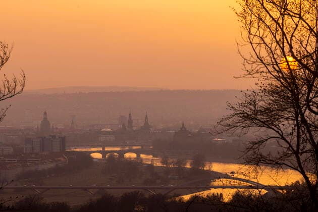 Dresden in winter Due to a special weather situation, large amounts of Sahara dust entered the atmosphere and colored the morning evening skies particularly intensively, as here over the old town of Dresden Dresden Saxony GERMANY