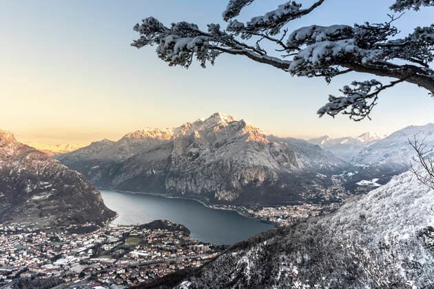 Italy, Lecco, Lake Como, View of mountains and lake in valley on winter day MCVF00725