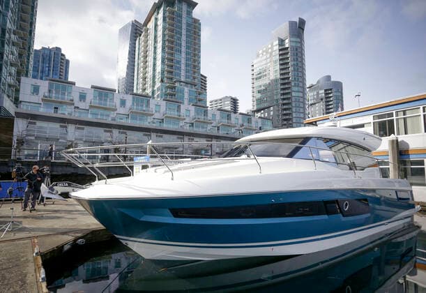 (210224) -- VANCOUVER, Feb. 24, 2021 -- A cruiser boat for display during the 2021 Vancouver International Boat Show is seen at a harbour in Vancouver, British Columbia, Canada, Feb. 24, 2021. The Vancouver International Boat Show which goes virtual this year due to the COVID-19 pandemic, kicked off on Wednesday, showcasing hundreds of new boats, products and accessories online. (Photo by Xinhua) CANADA-VANCOUVER-INTERNATIONAL BOAT SHOW LiangxSen 