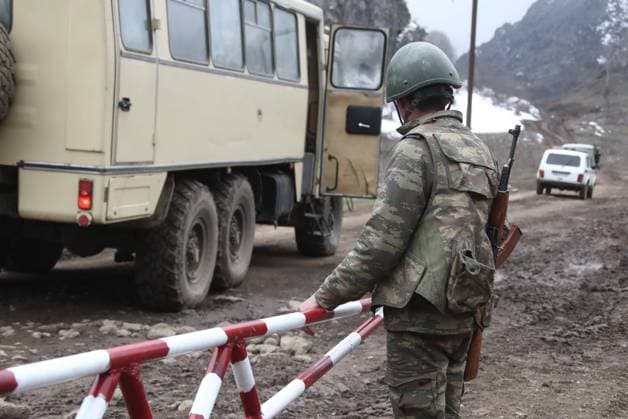 AZERBAIJAN - FEBRUARY 24, 2021: A serviceman at an Azerbaijani military outpost by the Agaoglan Monastery in Lachin District. The fighting between Armenia and Azerbaijan over the disputed Caucasus Mountains territory of Nagorno-Karabakh resumed in late September; on November 9, Armeniaâ€™s Prime Minister Nikol Pashinyan, Russiaâ€™s President Vladimir Putin, and Azerbaijanâ€™s President Ilham Aliyev signed a trilateral statement on a complete ceasefire in Nagorno-Karabakh. The agreement also provides for the deployment of a Russian peacekeeping mission along the contact line and the Lachin Corridor mountain pass. Valery Sharifulin TASS  TS0F7AC3