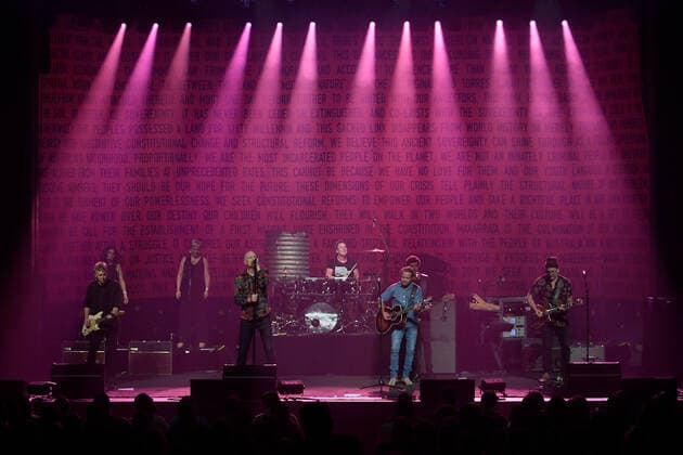MIDNIGHT OIL MAKARRATA LIVE SYDNEY, Midnight Oil are joined on stage by Troy Cassar-Daley with the Uluru Statement of the Heart as a backdrop during a warm-up show ahead of their Makarrata Project tour, at the Enmore Theatre, in Sydney, Thursday, February 25, 2021. ( NO ARCHIVING, EDITORIAL USE ONLY, NO USE IN BOOKS WITHOUT CONSENT SYDNEY NSW AUSTRALIA  Copyright: xDANxHIMBRECHTSx 20210225001523165321