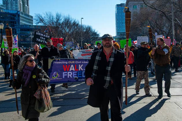 February 27, 2021, Calgary, Alberta, Canada: Preacher David Pawlowsk (center) leads the anti-mask protest Freedom March in Calgary, AB on 27 Feb, 2021. The march was led by people who carried tiki torches said to signify the light of the lord but also reminiscent of the Charlottesville Unite the Right rally in 2017. Calgary Canada - ZUMAj113 20210227_zip_j113_005 Copyright: xGavinxJohnx
