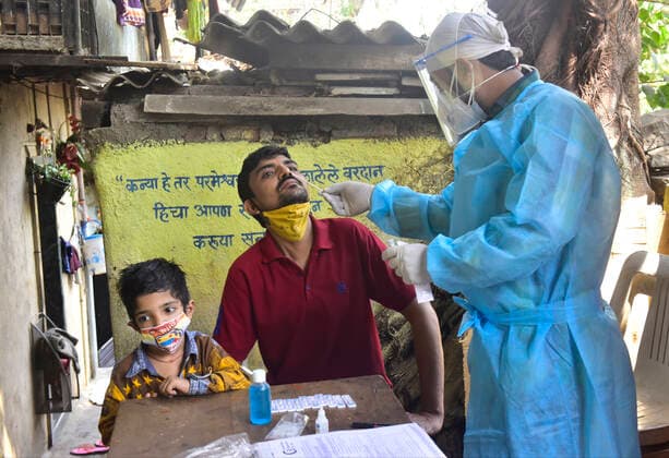 MUMBAI, INDIA - FEBRUARY 27: BMC medical staff conducts swab test of resident staying in Sewri, on February 28, 2021 in Mumbai, India. (Photo by Anshuman Poyrekar Hindustan Times) Medical Team Conducts COVID-19 Coronavirus Test