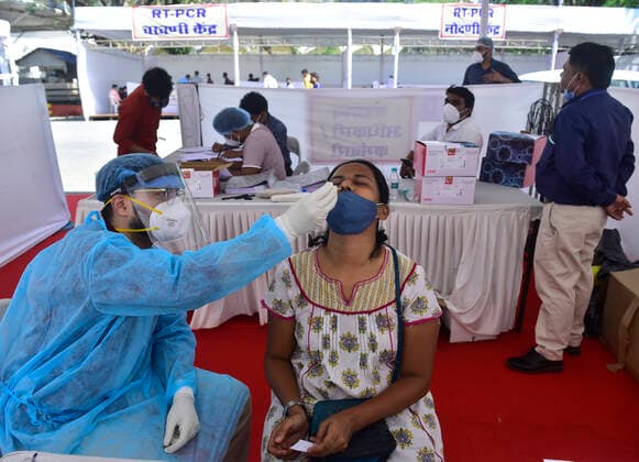 MUMBAI, INDIA - FEBRUARY 28: BMC medical staff conducts swab test of employees, Media person and security personnel assigned for Budget Session at Vidhan Bhavan, on February 28, 2021 in Mumbai, India. (Photo by Anshuman Poyrekar Hindustan Times) Medical Team Conducts COVID-19 Coronavirus Test