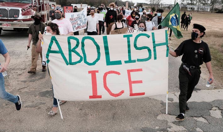 February 28, 2021, Ocilla, Georgia, USA: Two demonstrators carry a sign that reads ABOLISH ICE while marching at the Irwin County Detention Center in Ocilla, GA Ocilla USA - ZUMAb165 20210228_znp_b165_022 Copyright: xJohnxArthurxBrownx