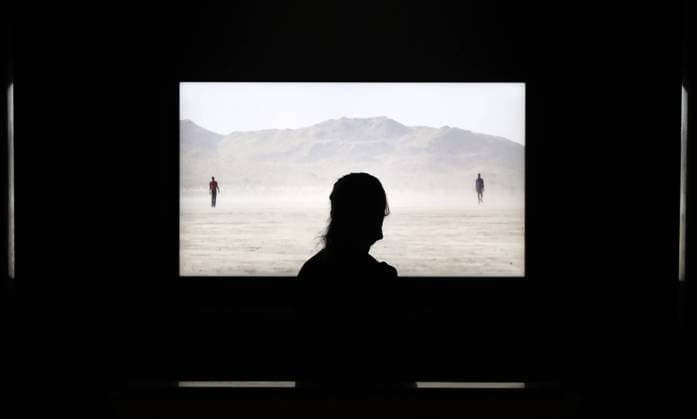 MOSCOW, RUSSIA - MARCH 1, 2021: A visitor at a press preview of The Journey of the Soul exhibition by American video artist Bill Viola at the Pushkin State Museum of Fine Arts. Anton Novoderezhkin TASS  TS0F8243