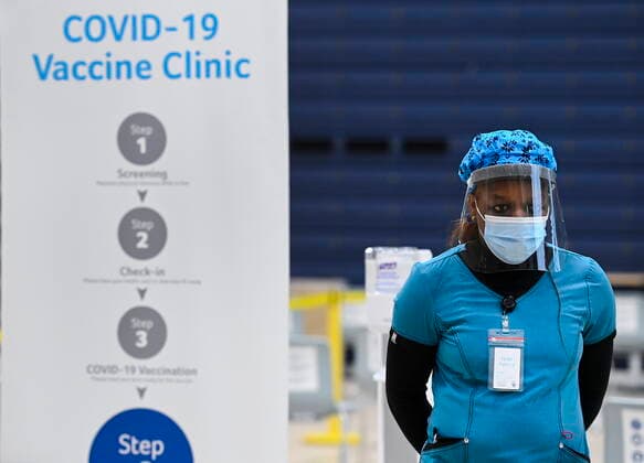 March 1, 2021, Mississauga, on, Canada: A health-care worker stands in the post vaccine waiting area at a mass COVID-19 vaccination clinic for Peel Region during the COVID-19 pandemic in Mississauga, Ont., on Monday, March 1, 2021. Mississauga Canada  - ZUMAc35_ 20210301_zaf_c35_061 Copyright: xNathanxDenettex