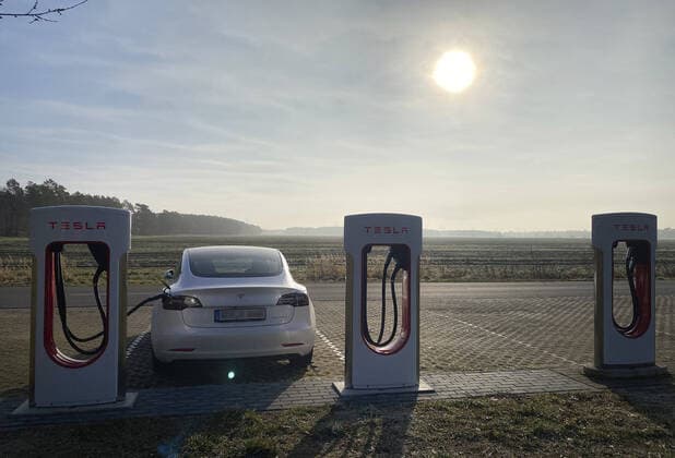 A Tesla Model 3 stands to charge at a Tesla Supercharger in Bersteland 02 05 2021, Besteland Germany. Copyright: xThomasxKoehler photothek.dex