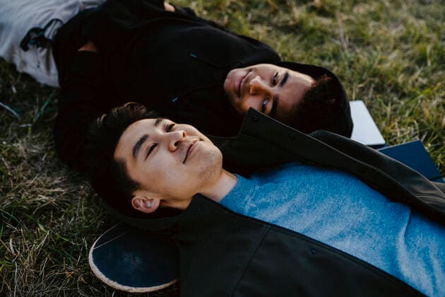 High angle view of male friends lying down Germany, Berlin, model released Copyright: xMaskotx , MA84316