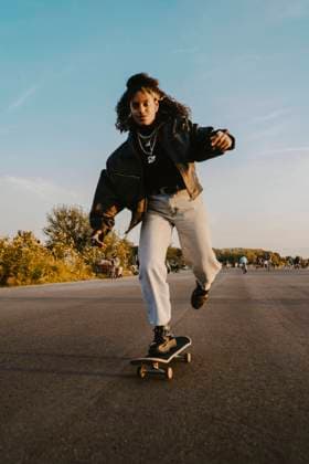Portrait of cheerful woman skating on road in park Germany, Berlin, model released Copyright: xMaskotx , MA84346