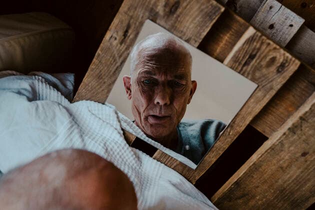 Directly above shot of senior man looking in mirror at home Germany, Berlin, model released, property released Copyright: xMaskotx , MA84868