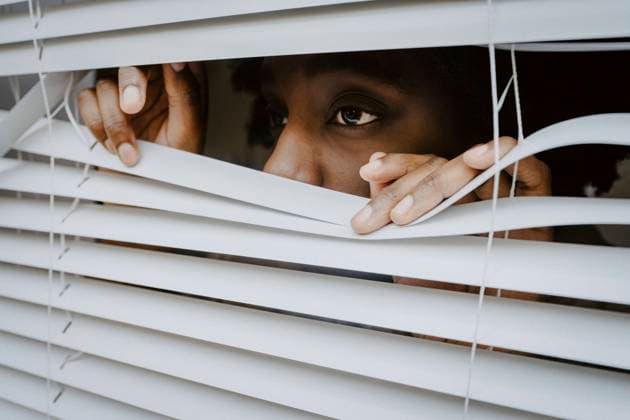 Creative Highlights Symbolbilder Depressed woman looking through window blinds Germany, Berlin, model released, property released Copyright: xMaskotx , MA84879