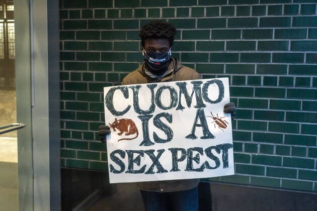 March 2, 2021, New York, United States: A protester holds a placard that says Cuomo is a sex pest during the demonstration..Protesters gather outside the Governor Andrew Cuomo s Third Avenue office calling Governor Cuomo to resign after a third woman accused Governor Cuomo of sexual harassment on March 3, 2021 in New York City. New York United States - ZUMAs197 20210302_zaa_s197_224 Copyright: xRonxAdarx