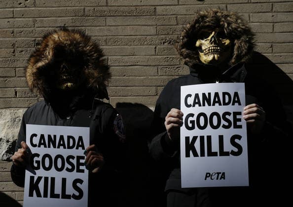 PETA protesters wearing skull masks and fake Canada Goose coats holds signs at a protest outside of a Canada Goose retail store in New York City on Wednesday, March 3, 2021. The protest is part of a week of action that will also include Canada Goose protests in Beverly Hills, California, Boston and Pittsburgh.  NYP20210303115 JohnxAngelillo