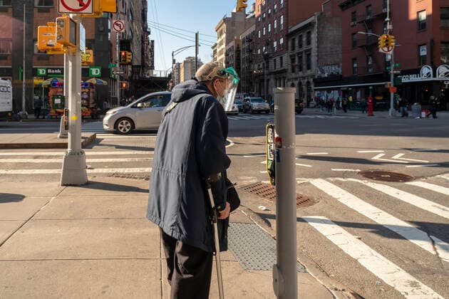 Activities in Chelsea in New York Elderly man with with face shield and cane waits at an intersection in Chelsea in New York on Wednesday, March 3, 2021. (  RichardxB.xLevine