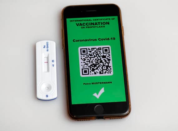 05 03 2021, vaccination, icon picture, a vaccination record in digital form on the smartphone iPhone A COVID 19 antigen test kit rapid test for self-testing in private use is included 05 03 2021, vaccination icon picture digital vaccination record and Corona rapid test 05 03 2021, vaccination icon picture digital vaccination record and Corona rapid test