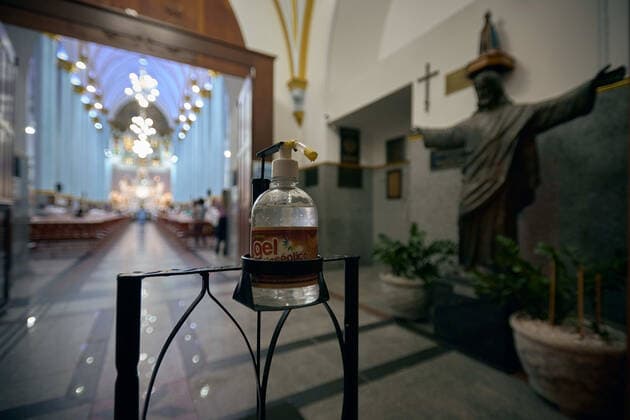 March 4, 2021, Franca, Sao Paulo, Brazil: Alcohol is offered at the door of the Cathedral of Our Lady of the Immaculate Conception, in Franca, Sao Paulo, Brazil on 4 March 2021. The governor of Sao Paulo, Joao Doria, announced a red flag starting at 12:00 am next Saturday, 6 March 2021, for the entire state, signaling that only essential services will be allowed to operate, framing religious celebrations as essential. The measure aims to curb the rate of contamination by coronavirus, which transmits covid-19, after the number of hospitalizations and deaths has hit consecutive records. Franca Brazil - ZUMAv129 20210304_znp_v129_010 Copyright: xIgorxDoxValex