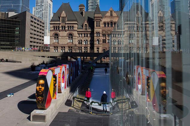 (210305) -- TORONTO, March 5, 2021 -- People take photos in front of the Toronto Sign at Nathan Phillips Square in Toronto, Canada, on March 5, 2021. The global COVID-19 pandemic, including the associated restrictions and lockdowns over the past 12 months, have resulted in 8.35 billion Canadian dollars (about 6.6 billion U.S. dollars) in lost economic activity from visitor spending in Toronto, according to a press release by Destination Toronto on Thursday. (Photo by Xinhua) CANADA-TORONTO-COVID-19-TOURISM ZouxZheng 