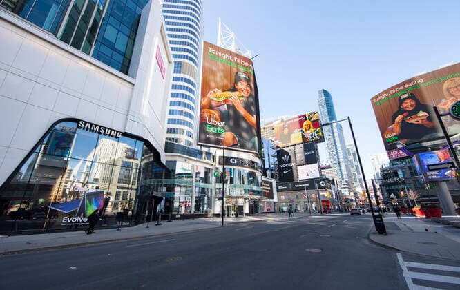 (210305) -- TORONTO, March 5, 2021 -- Few people are seen at Yonge-Dundas Square in Toronto, Canada, on March 5, 2021. The global COVID-19 pandemic, including the associated restrictions and lockdowns over the past 12 months, have resulted in 8.35 billion Canadian dollars (about 6.6 billion U.S. dollars) in lost economic activity from visitor spending in Toronto, according to a press release by Destination Toronto on Thursday. (Photo by Xinhua) CANADA-TORONTO-COVID-19-TOURISM ZouxZheng 