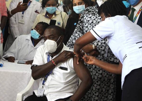 (210306) -- NAIROBI, March 6, 2021 -- A resident receives a shot of the AstraZeneca COVID-19 vaccine at Kenyatta National Hospital in Nairobi, Kenya, March 5, 2021. Kenya s health ministry on Friday kicked off COVID-19 vaccination campaign with frontline health workers as the first to receive the vaccine. (Photo by Xinhua) KENYA-NAIROBI-COVID-19-VACCINATION JoyxNabukewa 
