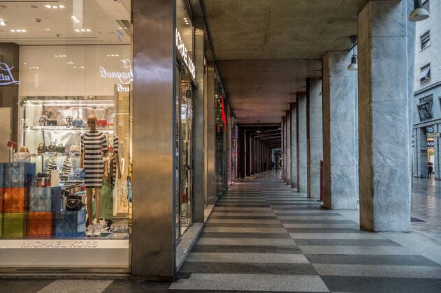 Milan. Dark Orange area few people in the street through the streets of the center In the photo corso vittorio emanuele with closed bars Editorial Usage Only  Copyright: xCarloxCozzolix xIPAx