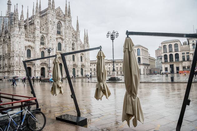 Milan. Dark Orange Zone few people in the street through the streets of the center In the photo closed bars in Piazza Duomo Editorial Usage Only  Copyright: xCarloxCozzolix xIPAx